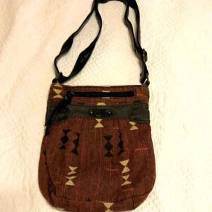 Dakine cotton crossbody bag with adjustable strap.